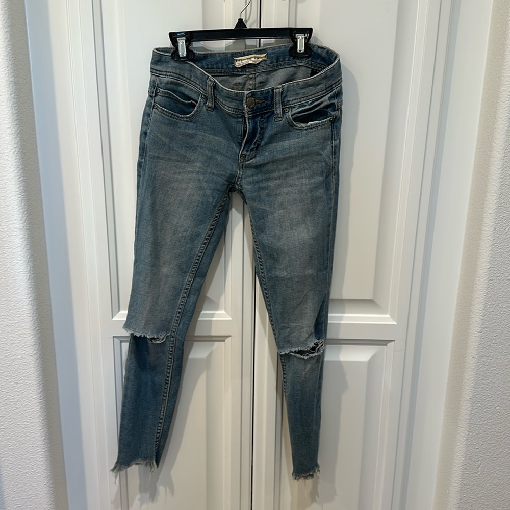 Blue Skinny Jeans with Distressed Details